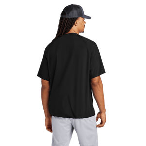 Back of model wearing black half-zip short sleeve jacket