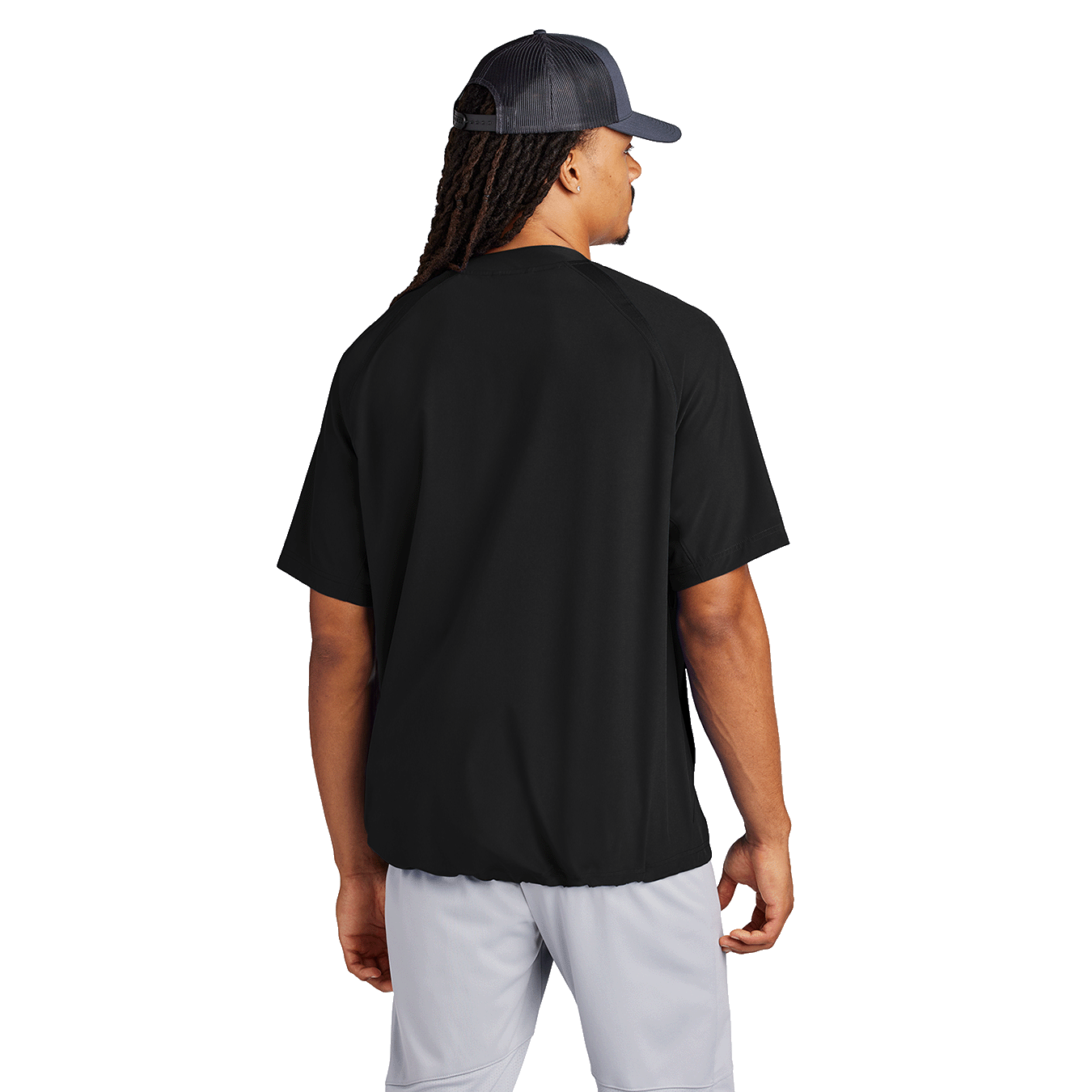 Back of model wearing black half-zip short sleeve jacket