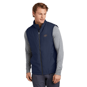 Model wearing navy vest with Insideya Golf icon on left chest