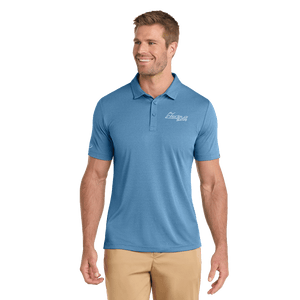Model wearing blue TravisMathew polo with Insideya Golf logo on left chest and right sleeve