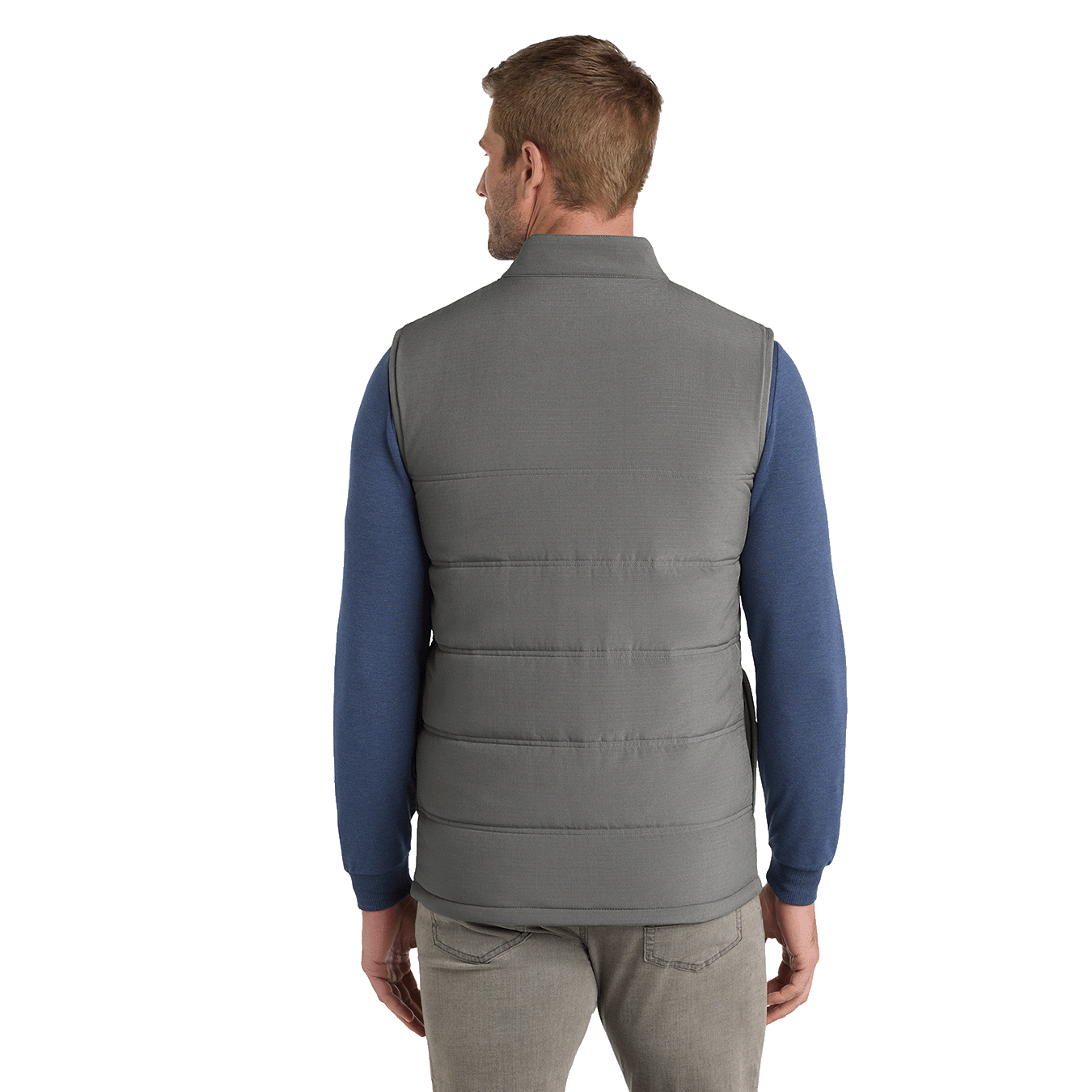 Back of model wearing grey TravisMathew vest